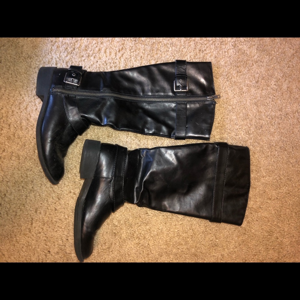 Tall black riding boots